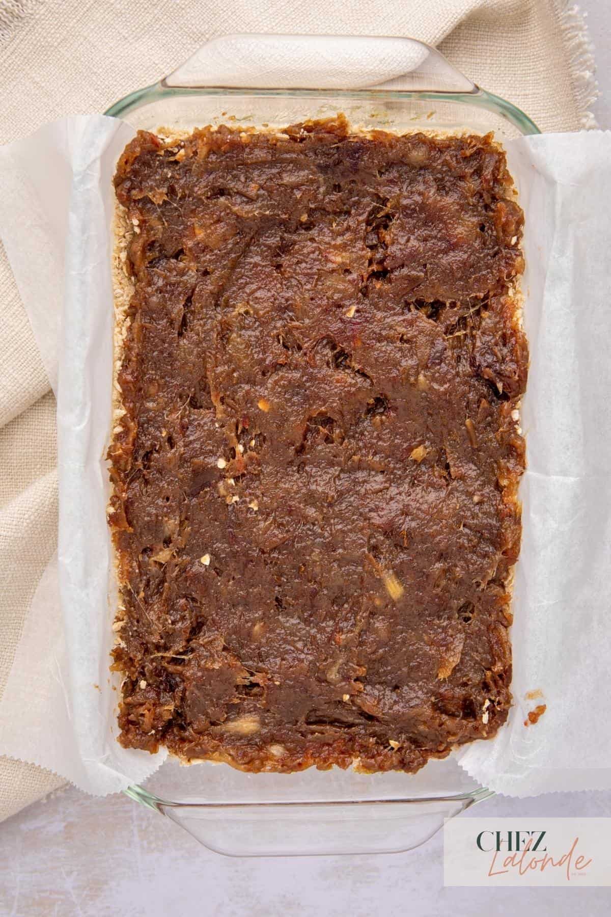 A baking dish with date filling in it.