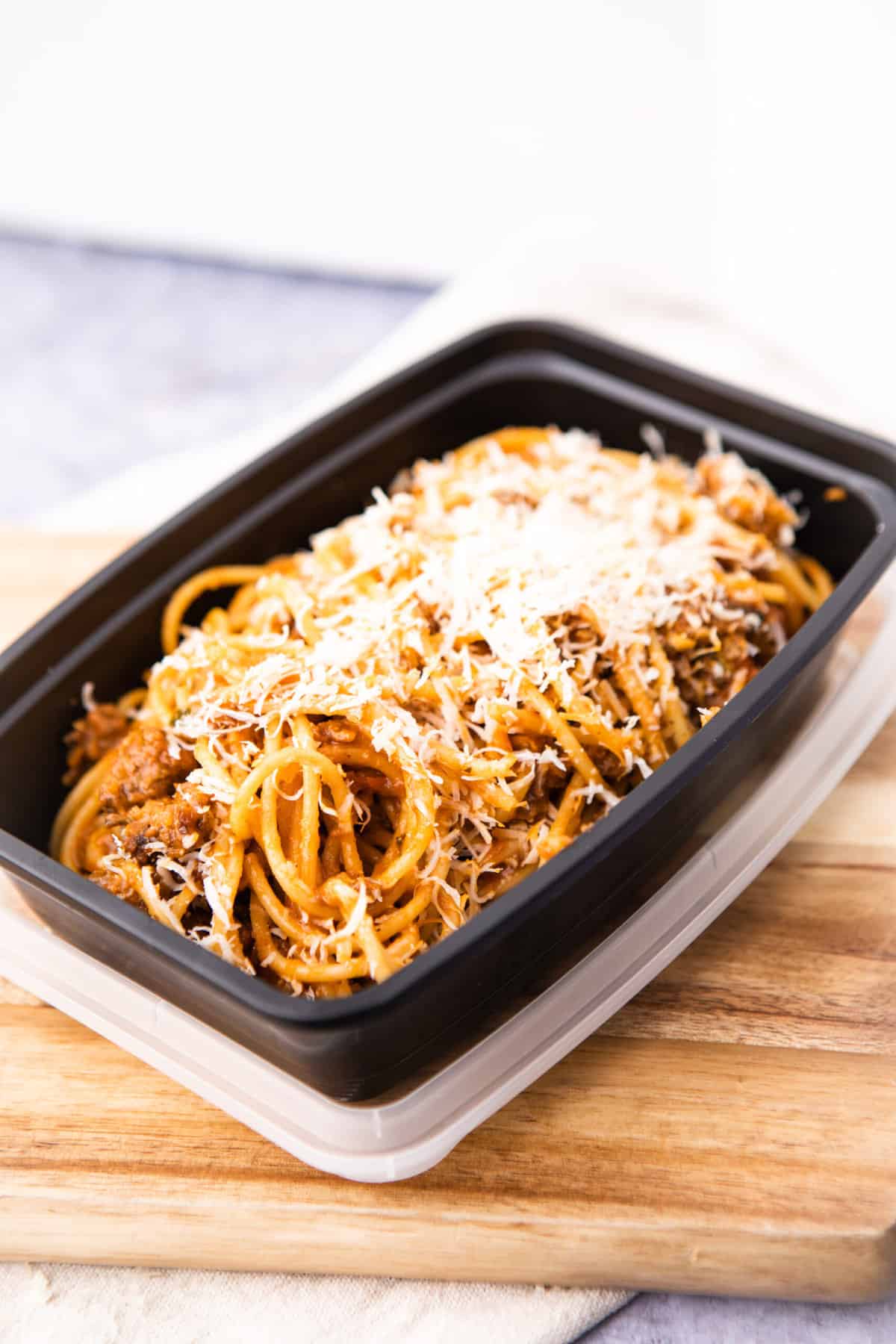 Leftover spaghetti meat sauce in a togo container 