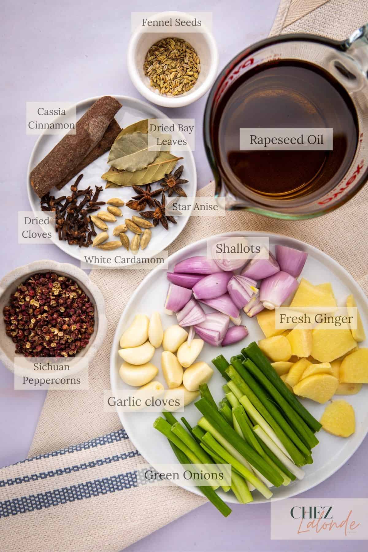 Group One ingredients : All ingredients needed for making Homemade chinese Chili Oil. You will need Rapeseed oil, Green onion, ginger, garlic, shallot, cassia cinnamon, Sichuan Peppercorn, Bay leaves, star anise, dried cloves, white cardamom, fennel seeds.