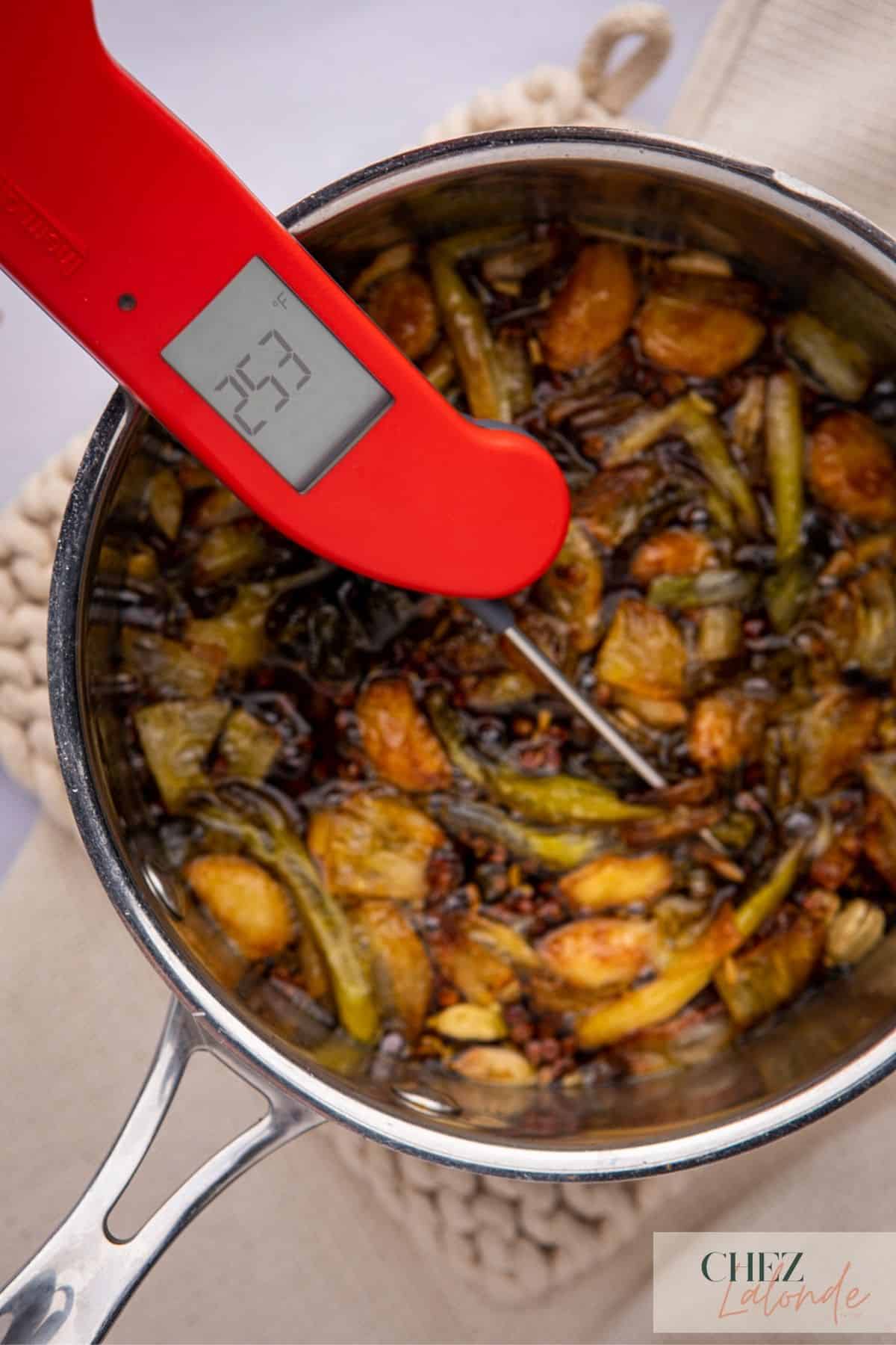 Use a cooking thermometer to check the temperature and lower the heat once it reaches 230 to 250F. 
