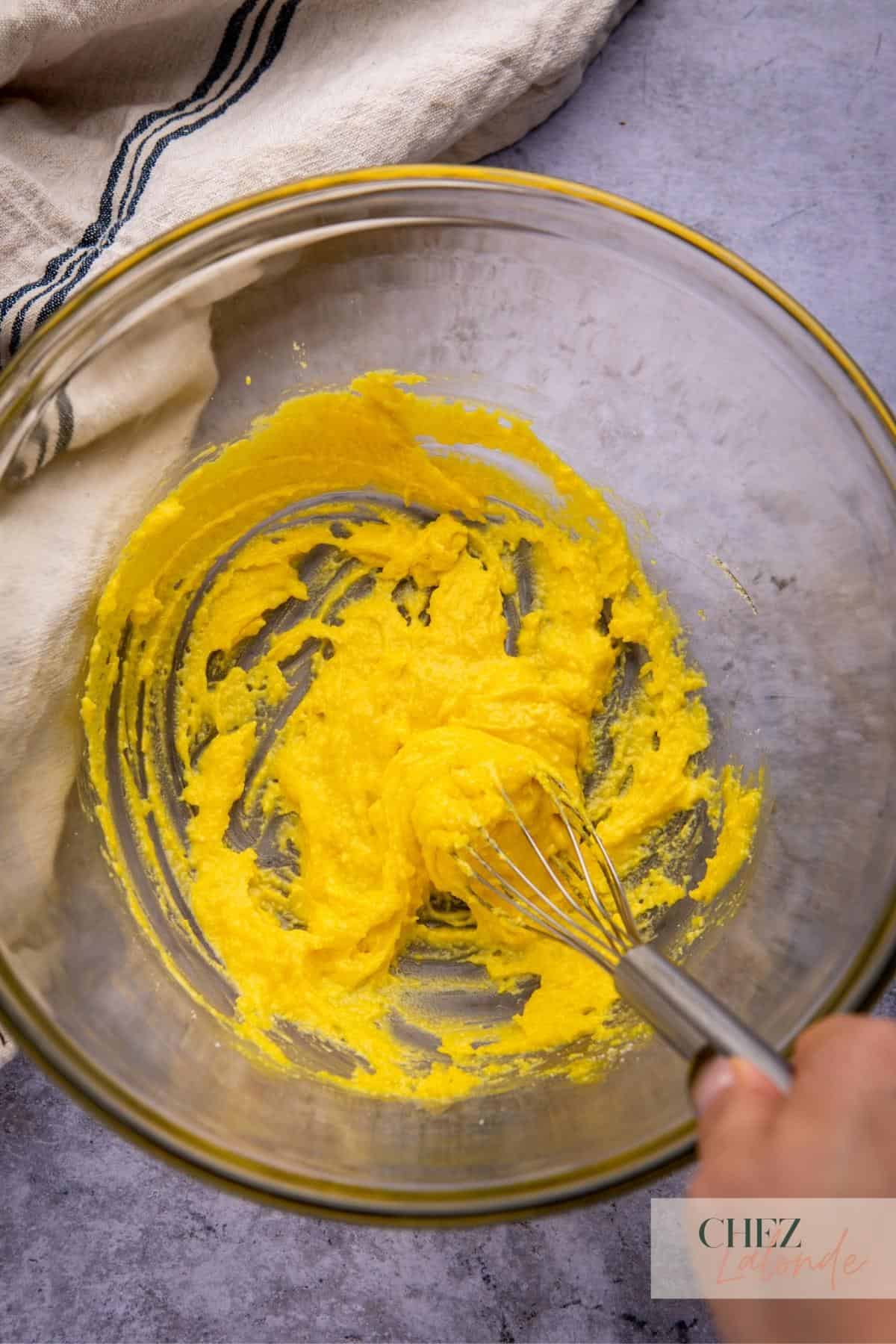 well combine egg yolks and cheese to a paste like consistency.