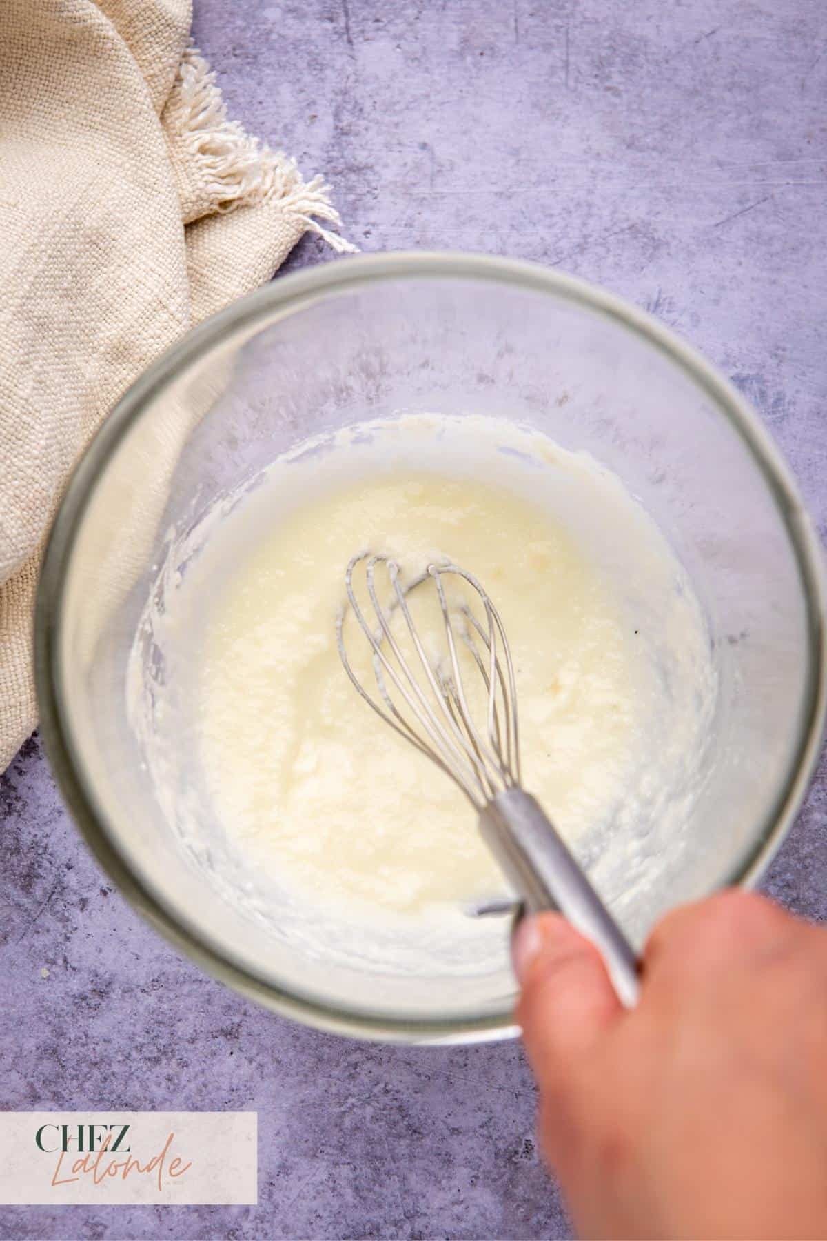 combine cheese and pasta water together for form a cream cheese paste.