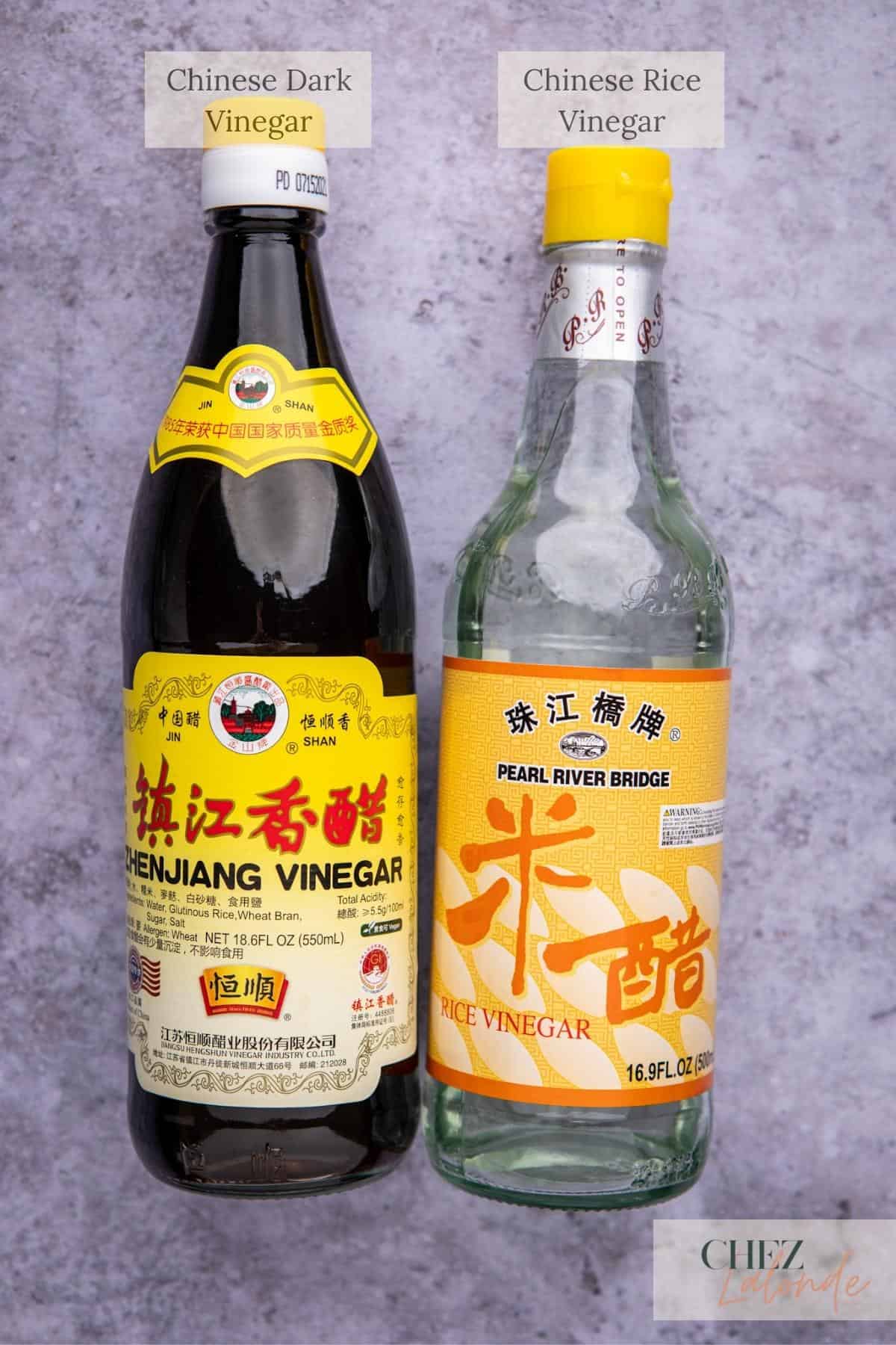 A bottle of Chinese dark vinegar on the left and a bottle of Chinese Rice Vinegar on the right. 