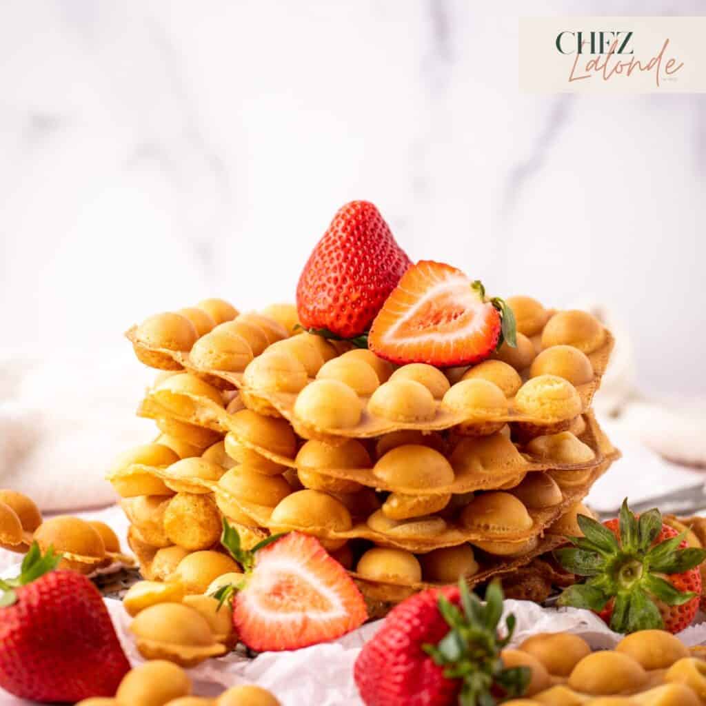 A stack of Hong Kong Bubble Waffles with Strawberries.