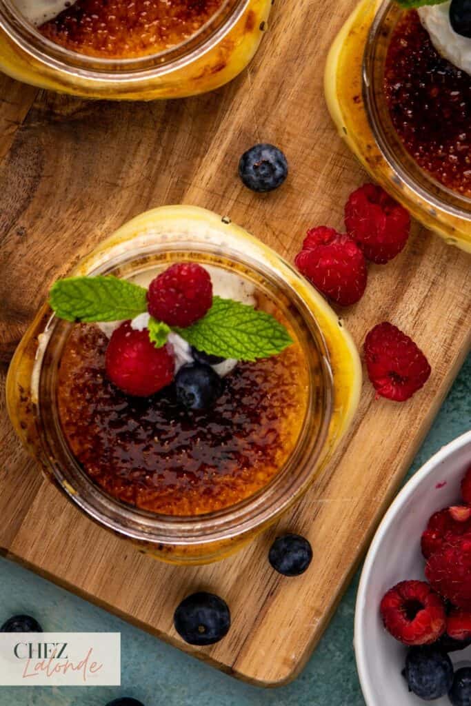 Sous Vide Creme Brulee in a jar with mint and mix berries.
