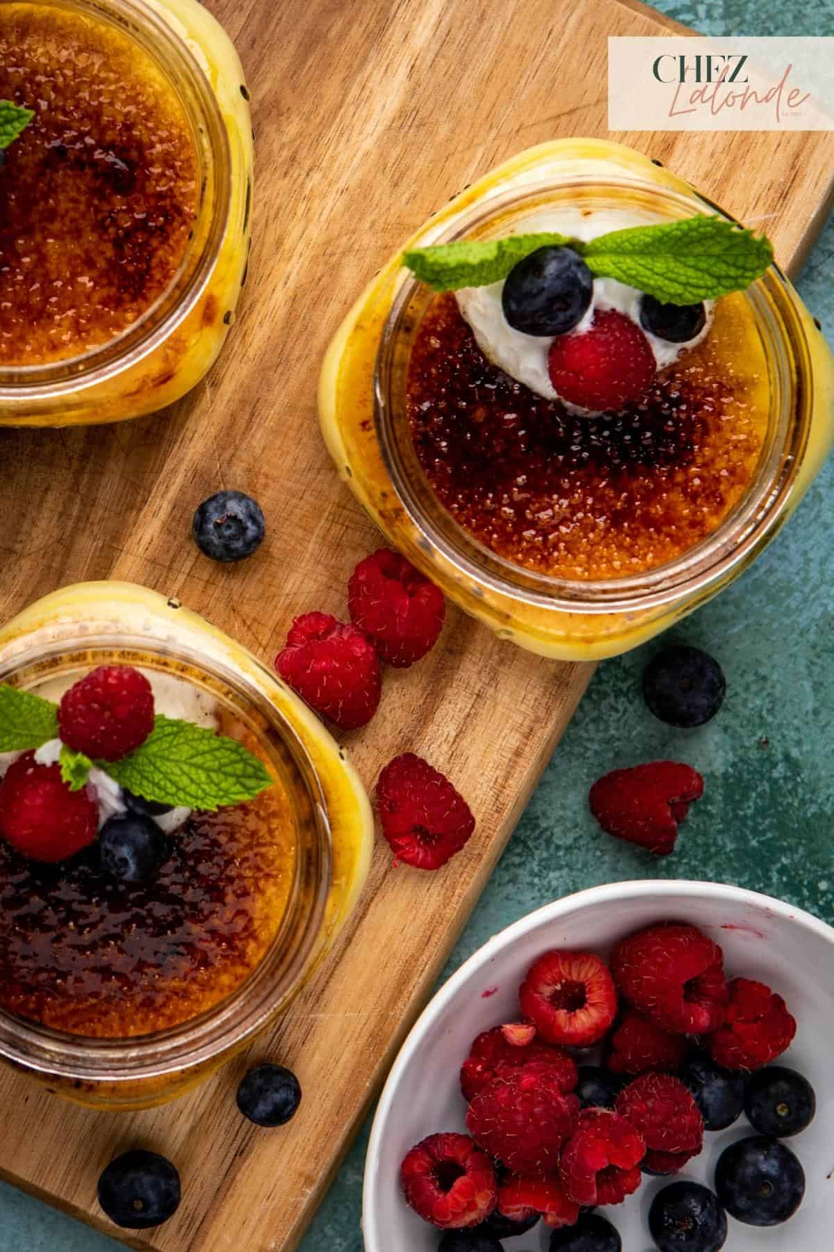 3 Creme Brulee in a jar with mixed berries. 
