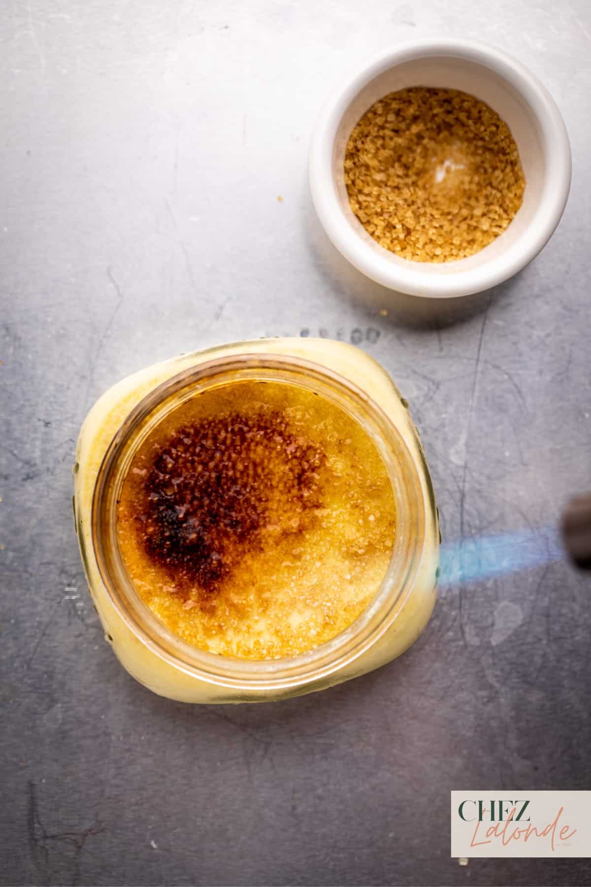 Use the kitchen torch to caramelize the custard surface to create the Brulee effect.