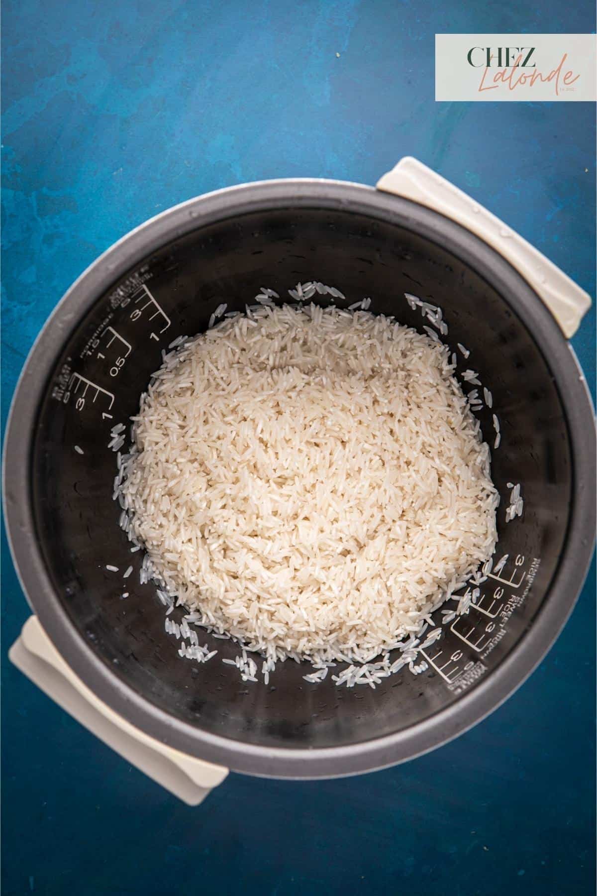 Washing rice in rice cooker. 