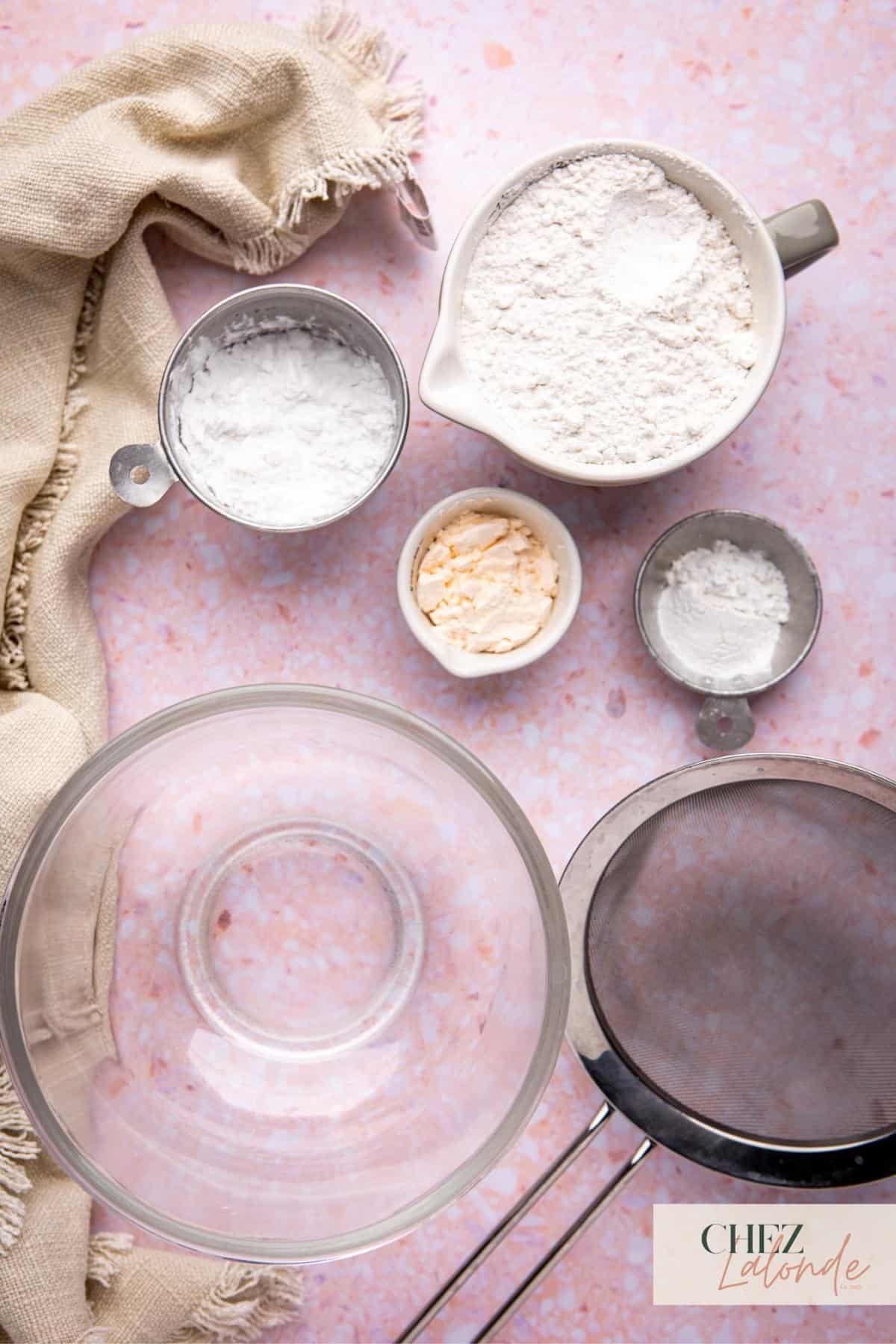 Dry ingredients to make Hong Kong bubble waffle batter.  Here are cake flour, baking powder, custard powder, and potato flour. 