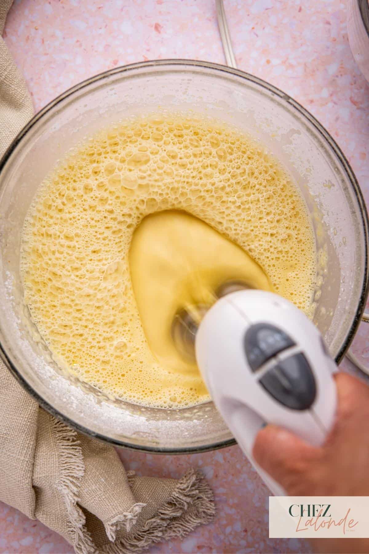 Using a hand mixer to combine all the ingredients together until smooth.