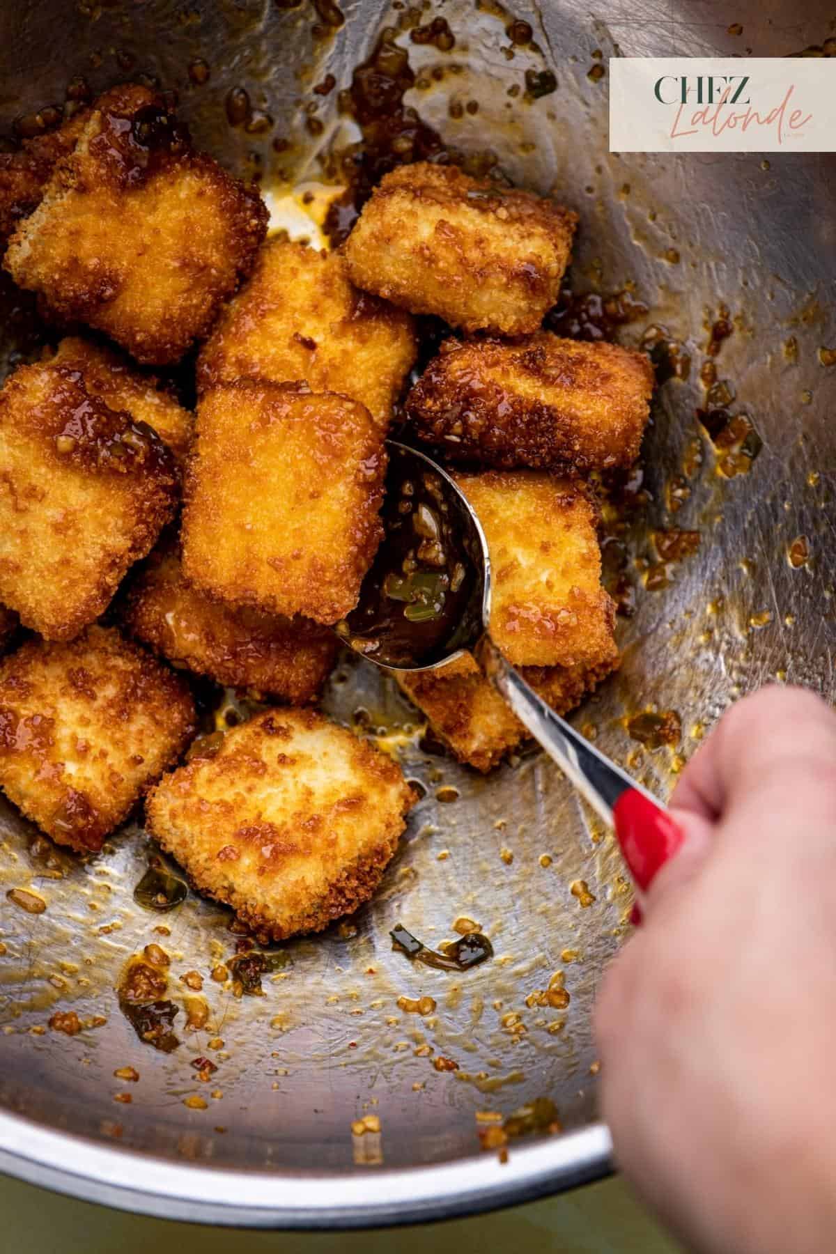 Mix Asian garlic sauce with tofu and make sure they are all coated well.