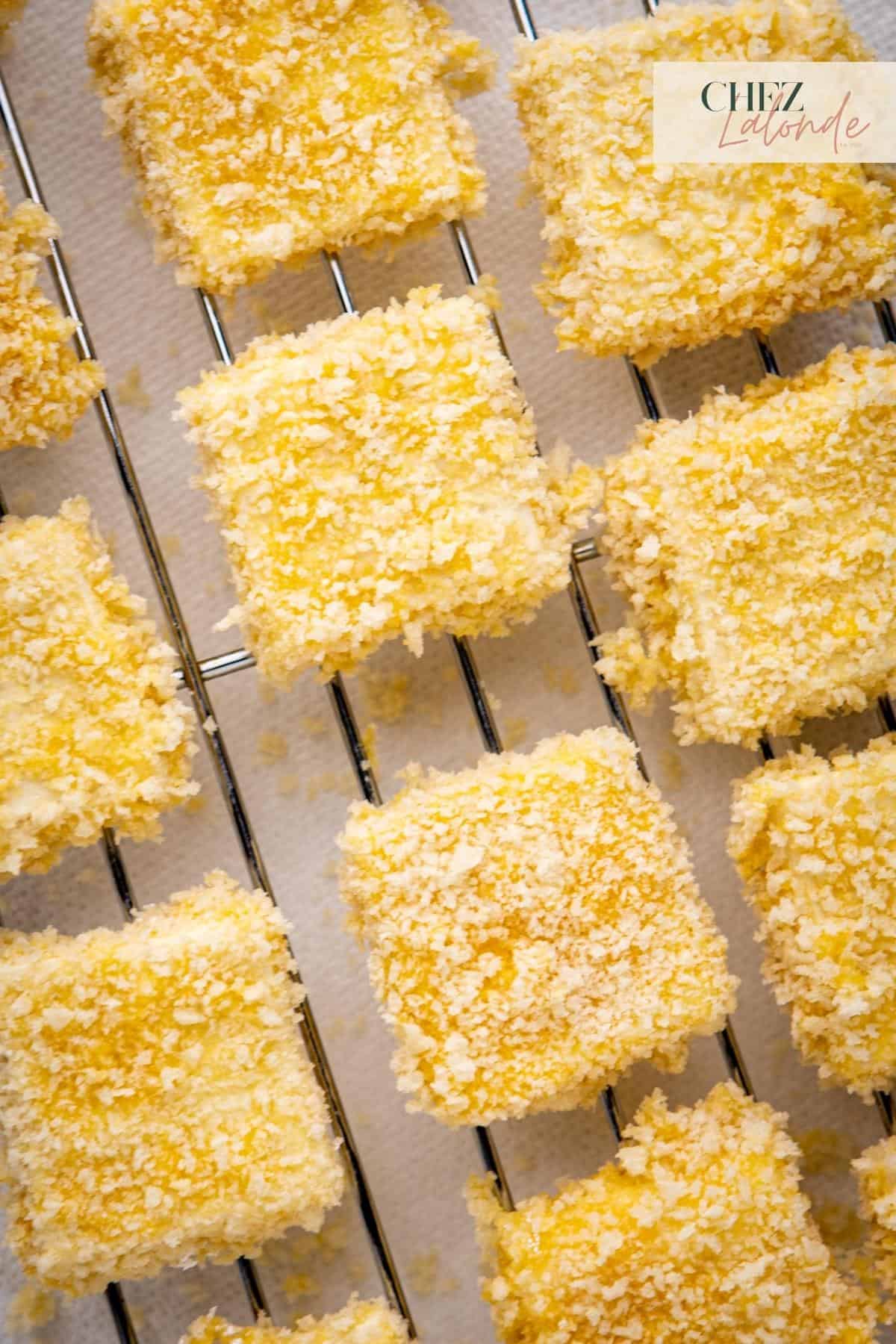 A tray of coated tofu ready to be air fried. 