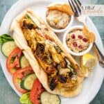Air fryer chicken shawarma wrapped in Naan bread. Served with fresh vegetables, lemon wedges, hummus, and Baba ganoush.