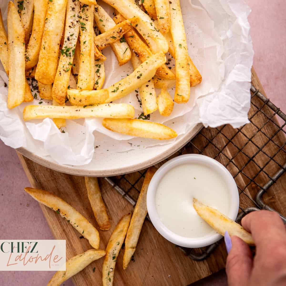 Dipping air fryer French fries into this traditional Lebanese Garlic sauce called Toum.