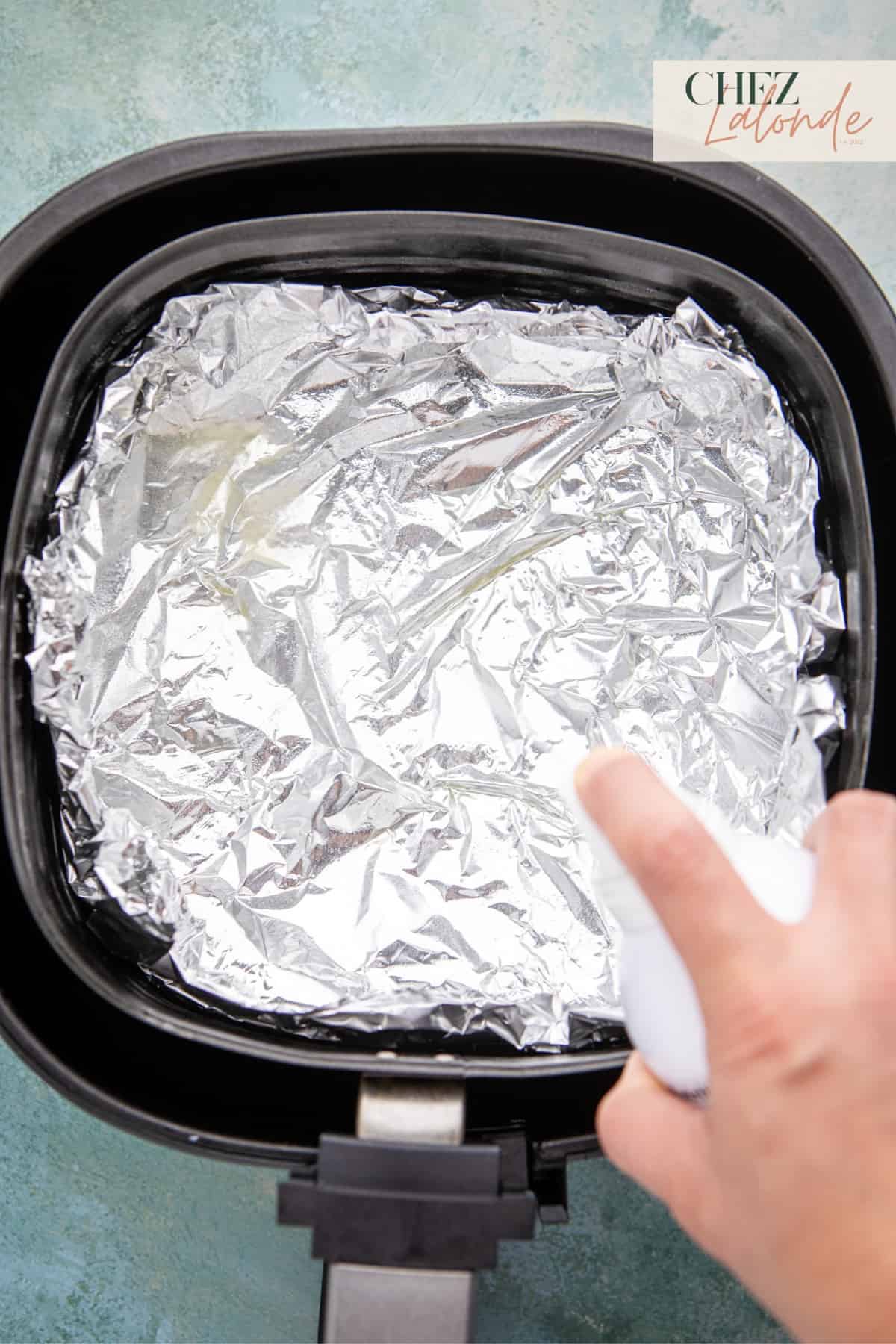 Line the air fryer basket with foil or a silicon air frying liner for easy cleaning.