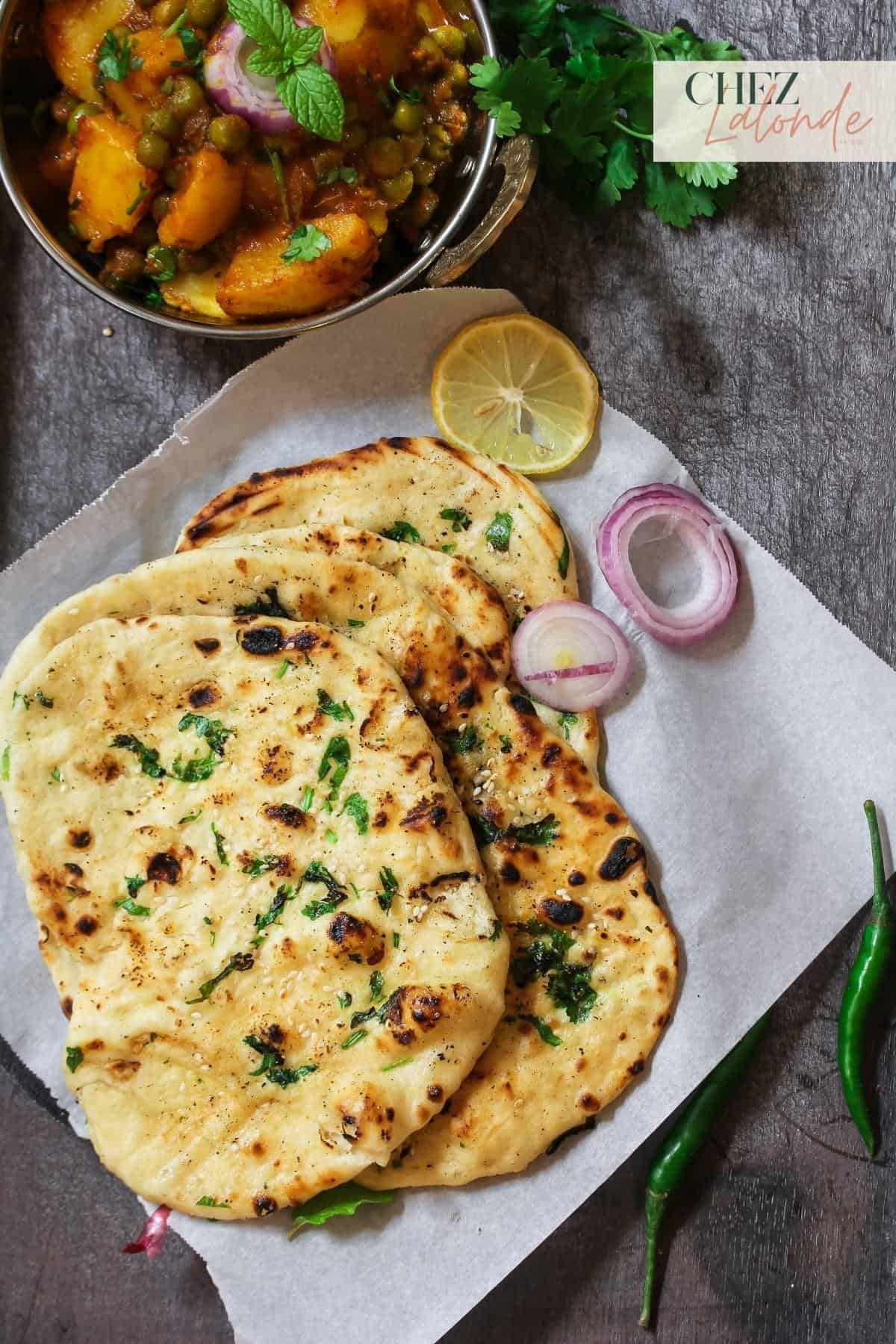 A plate of Naan bread served with Curry. 