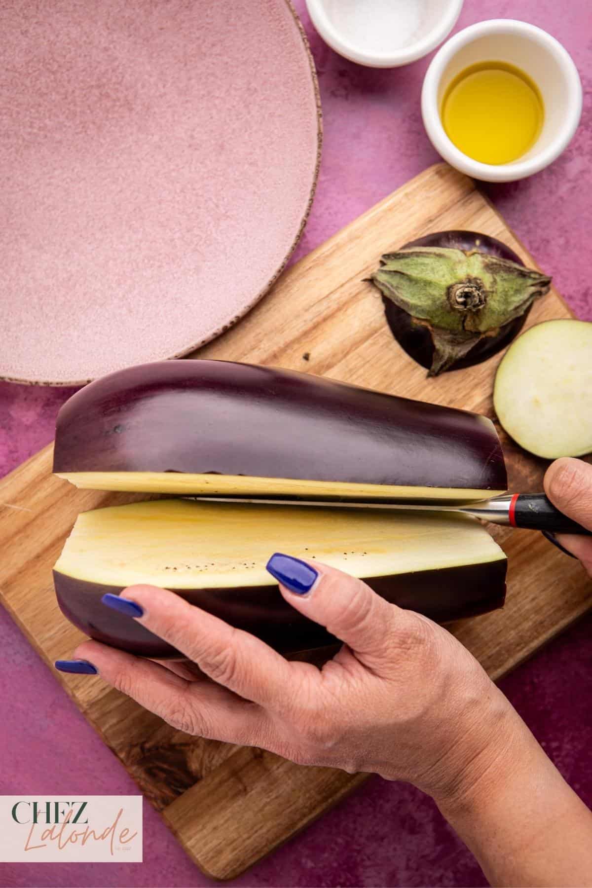 Slicing the eggplant in half for air frying.