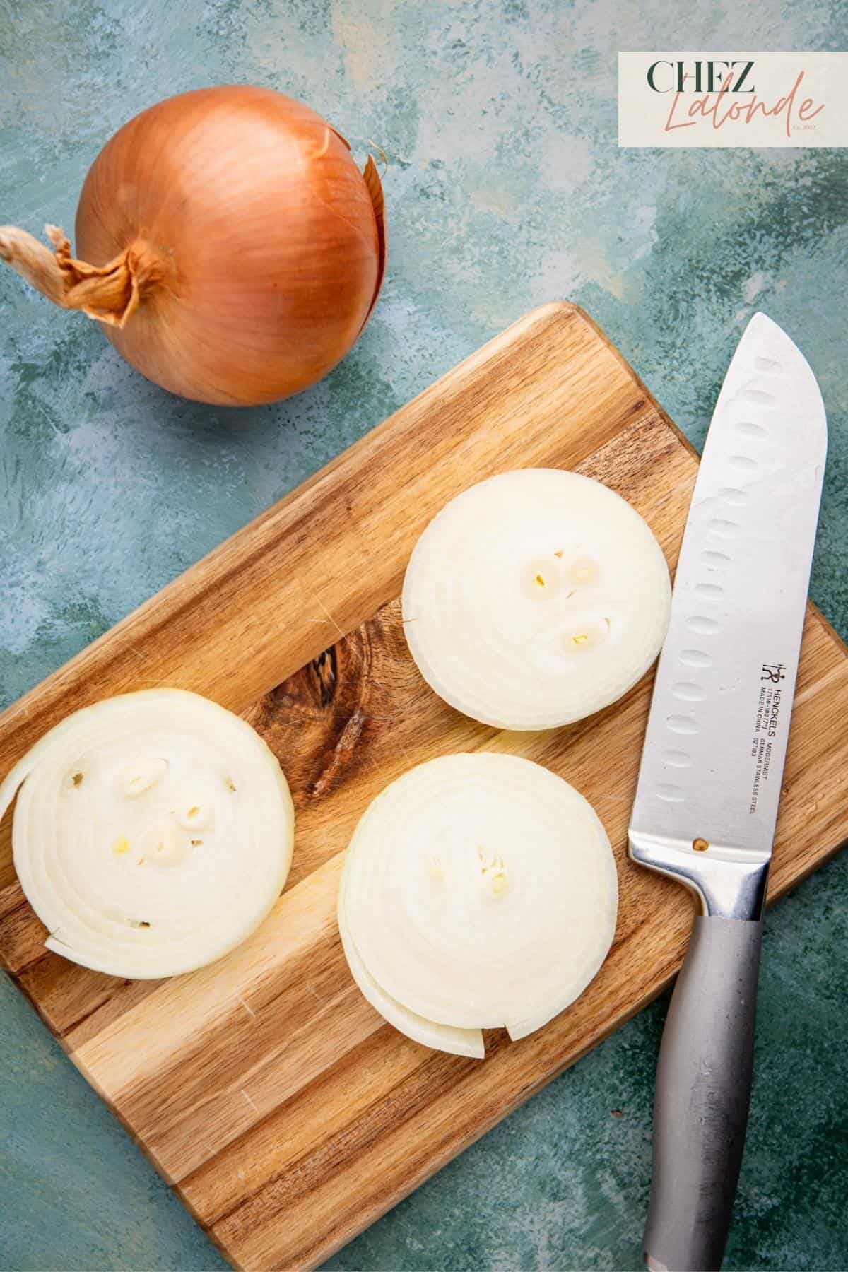 Slice a big yellow onion into 3 thick sections. 