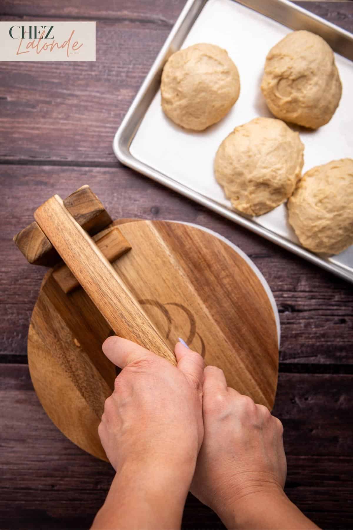 Use a tortilla press to press down the dough for even size and thickness. 