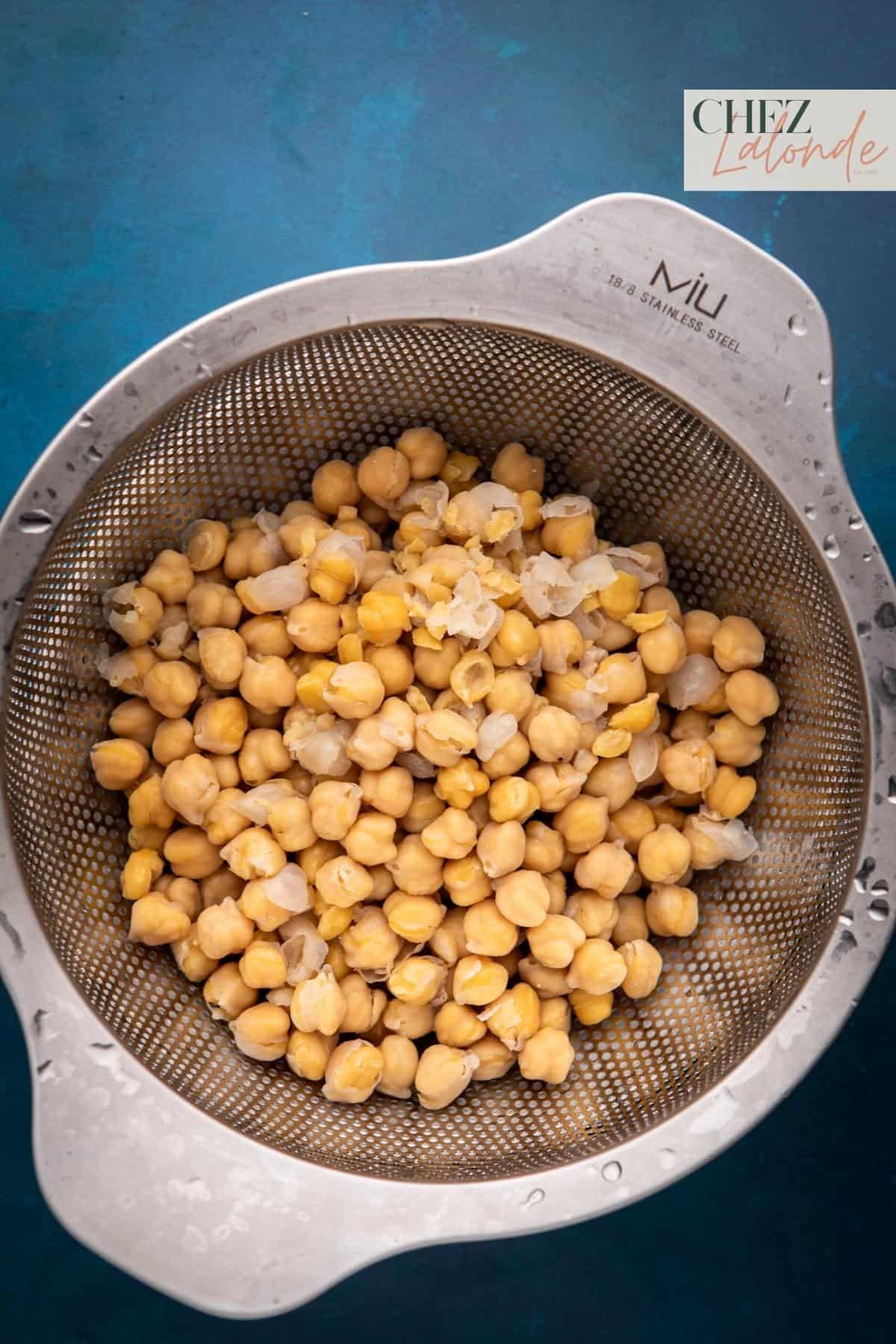 Drain canned chickpeas in colander. 