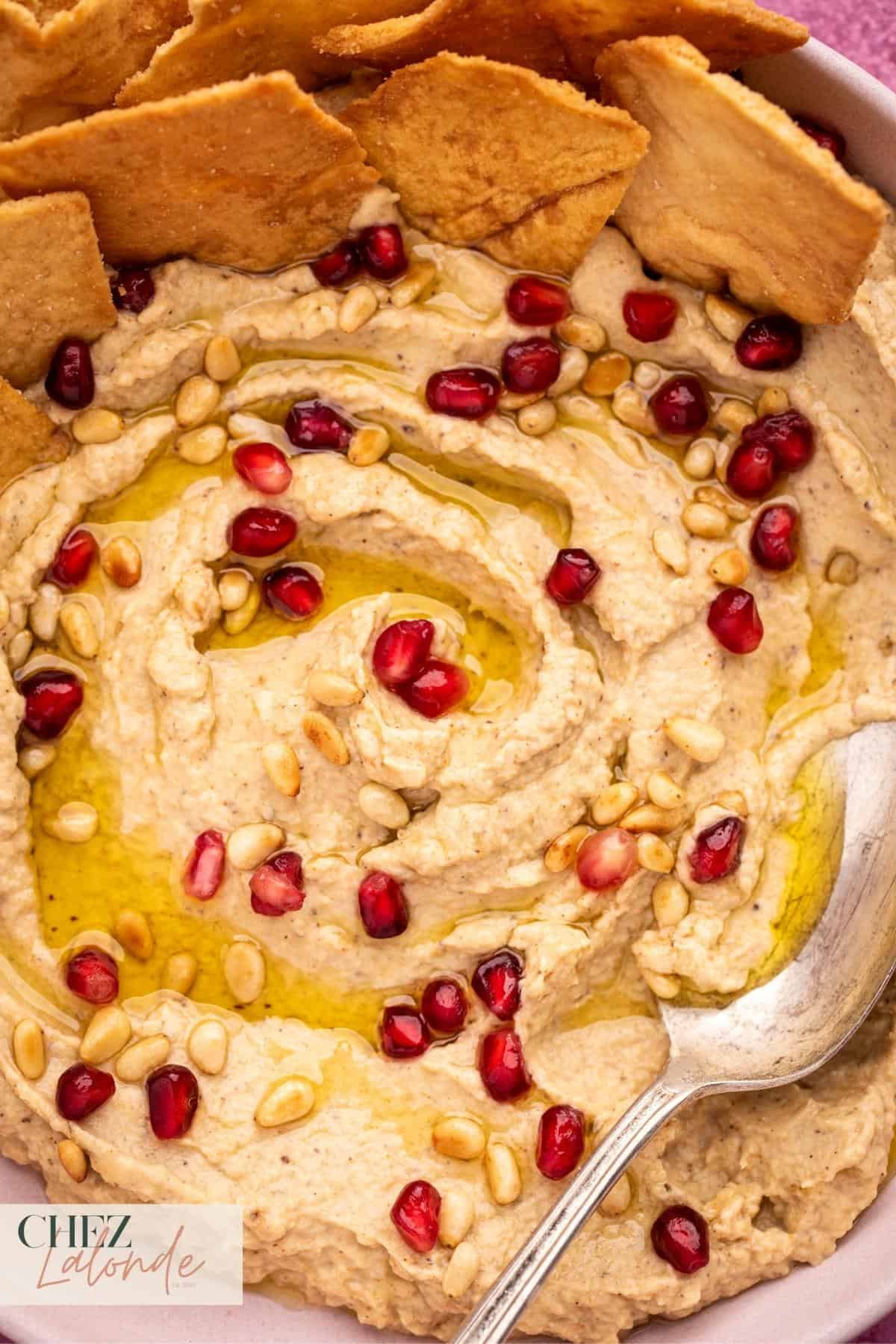 Baba Ganoush that garnished with Pomegranate seeds, toasted pine nuts, and olive oil. 