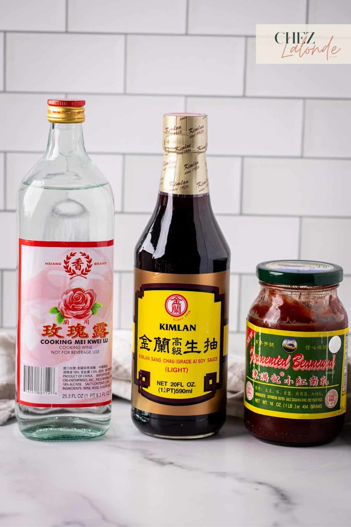 Photo to show my readers each Asian condiments that called for this recipe. From Left to right we have Chinese rose wine, soy sauce, and a jar of fermented red bean curd.