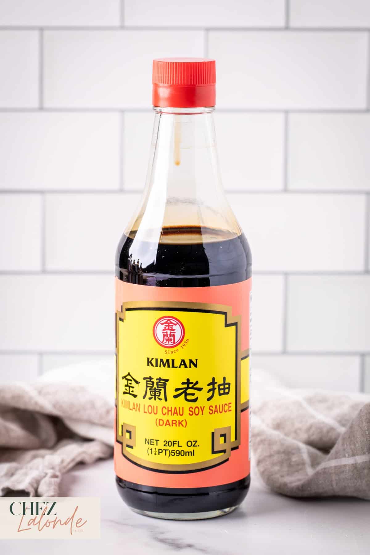A bottle of Kimlan Dark Soy Sauce.
