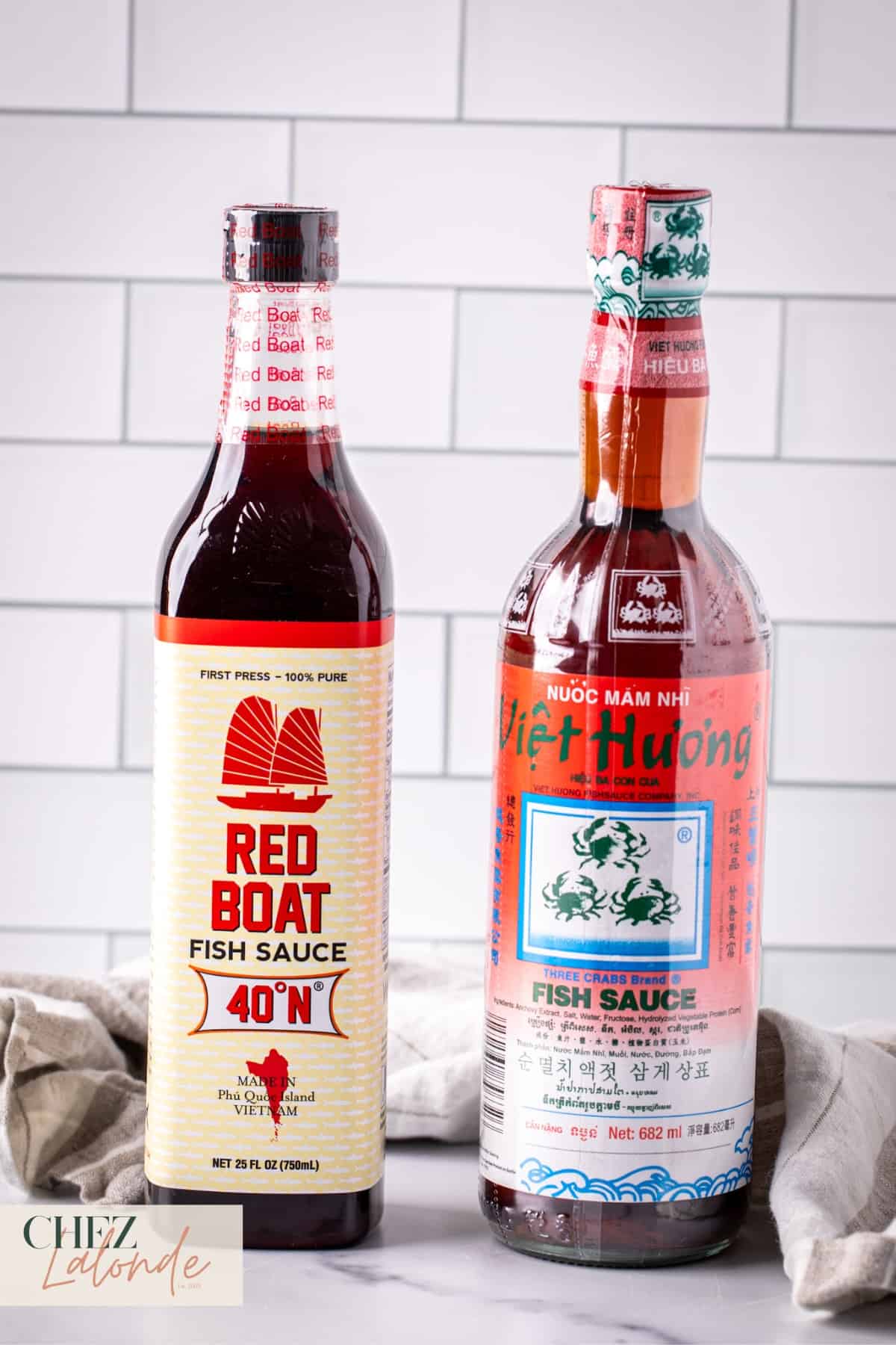 2 bottles of different brand fish sauce. 