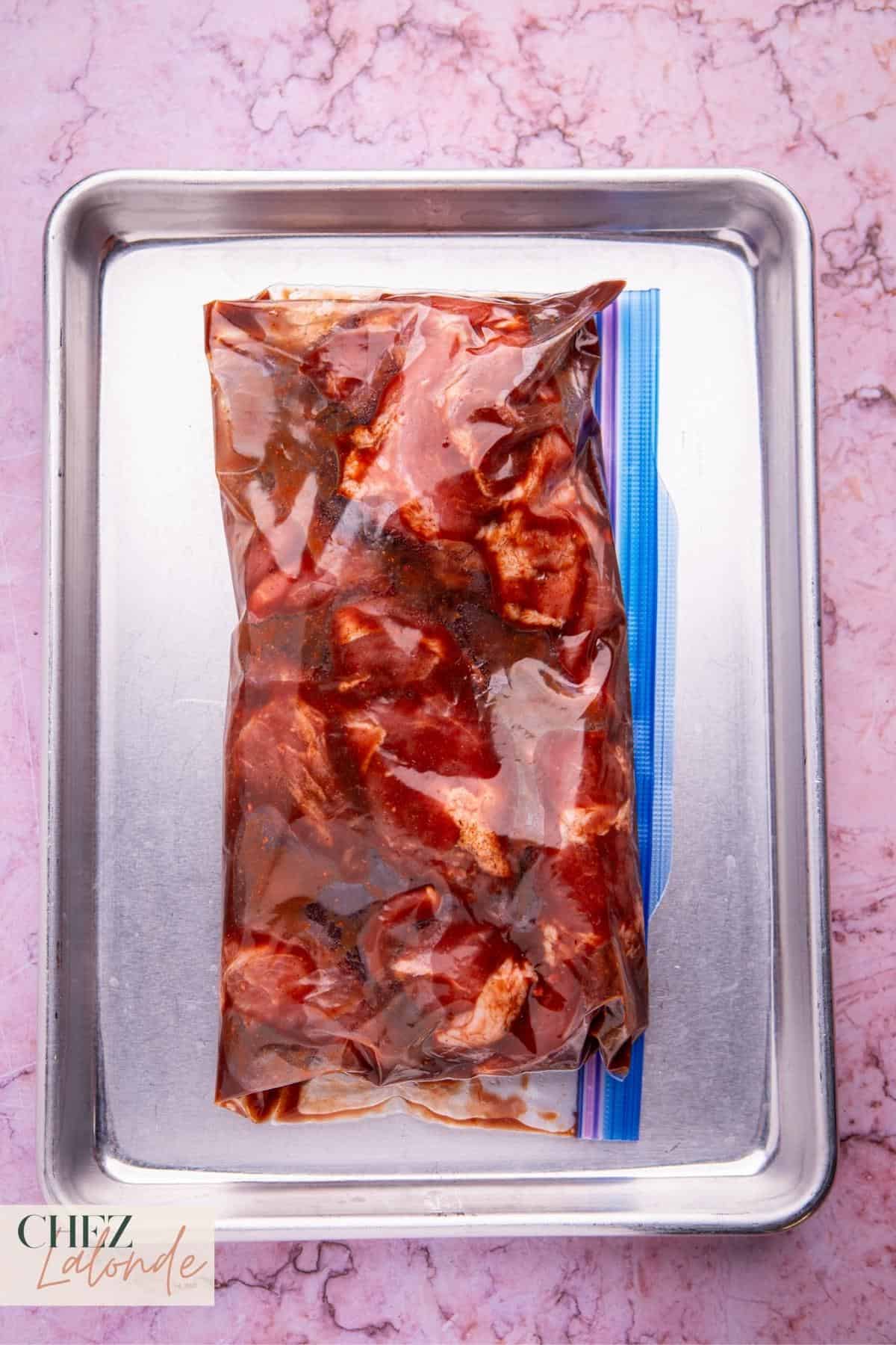 With the marinating process underway, transfer the bag to the refrigerator, allowing the pork to soak in the flavors for at least one hour. For intensified taste, feel free to let it marinate overnight.