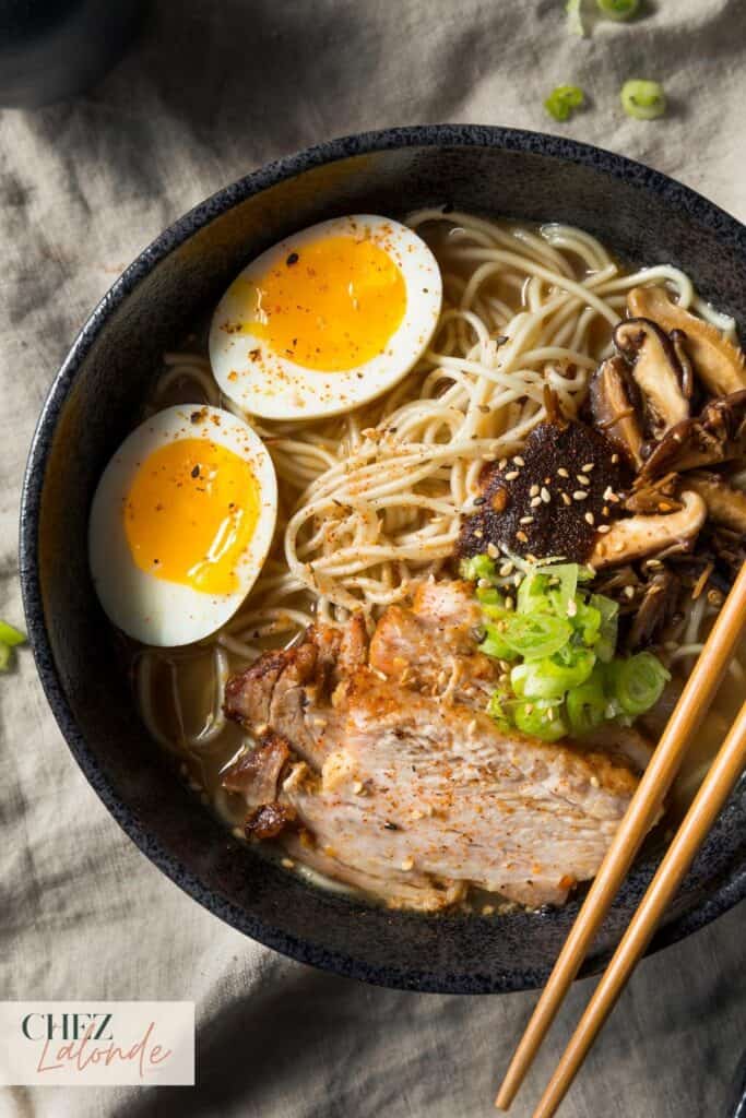 A bowl of Japanese ramen with slices of Japanese style BBQ pork.