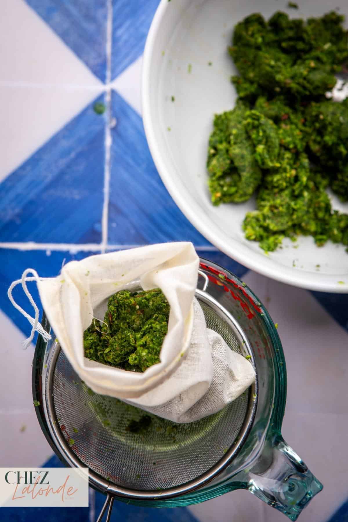 Move your herb and aromatic blend to a bowl. Take a few spoonfuls of the mixture and place it onto a cheesecloth.