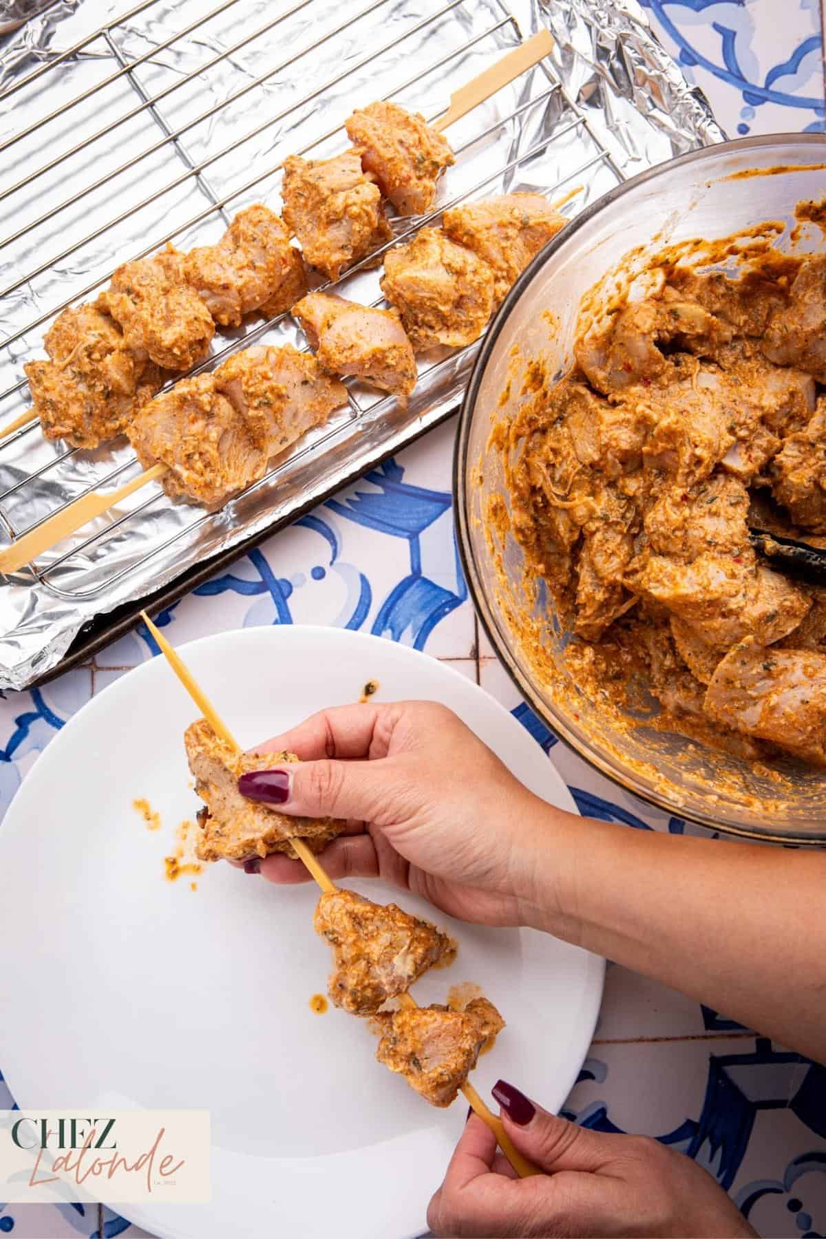 Once they are done soaking, take out the marinated chicken from the fridge and thread them onto the skewers. Make sure not to pack them too tightly and leave a little room between each piece for even cooking.