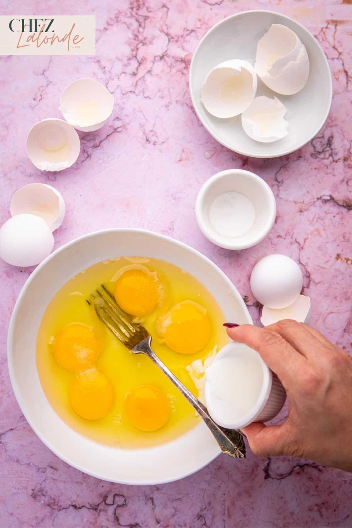 Crack five eggs into a small bowl, then add 1 tablespoon of milk and ½ teaspoon sea salt. 