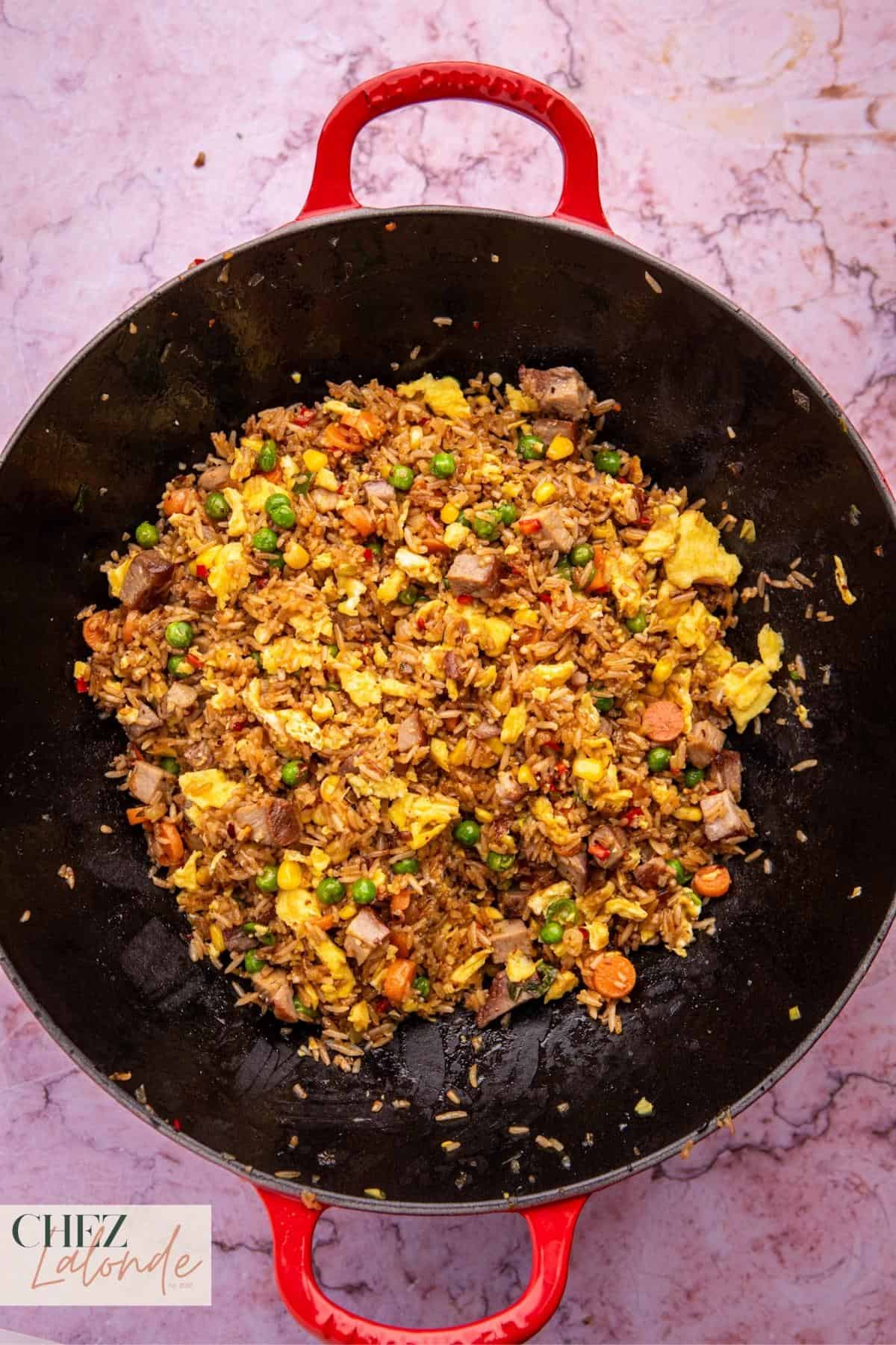 Cooked Char Siu Fried Rice in a wok. 